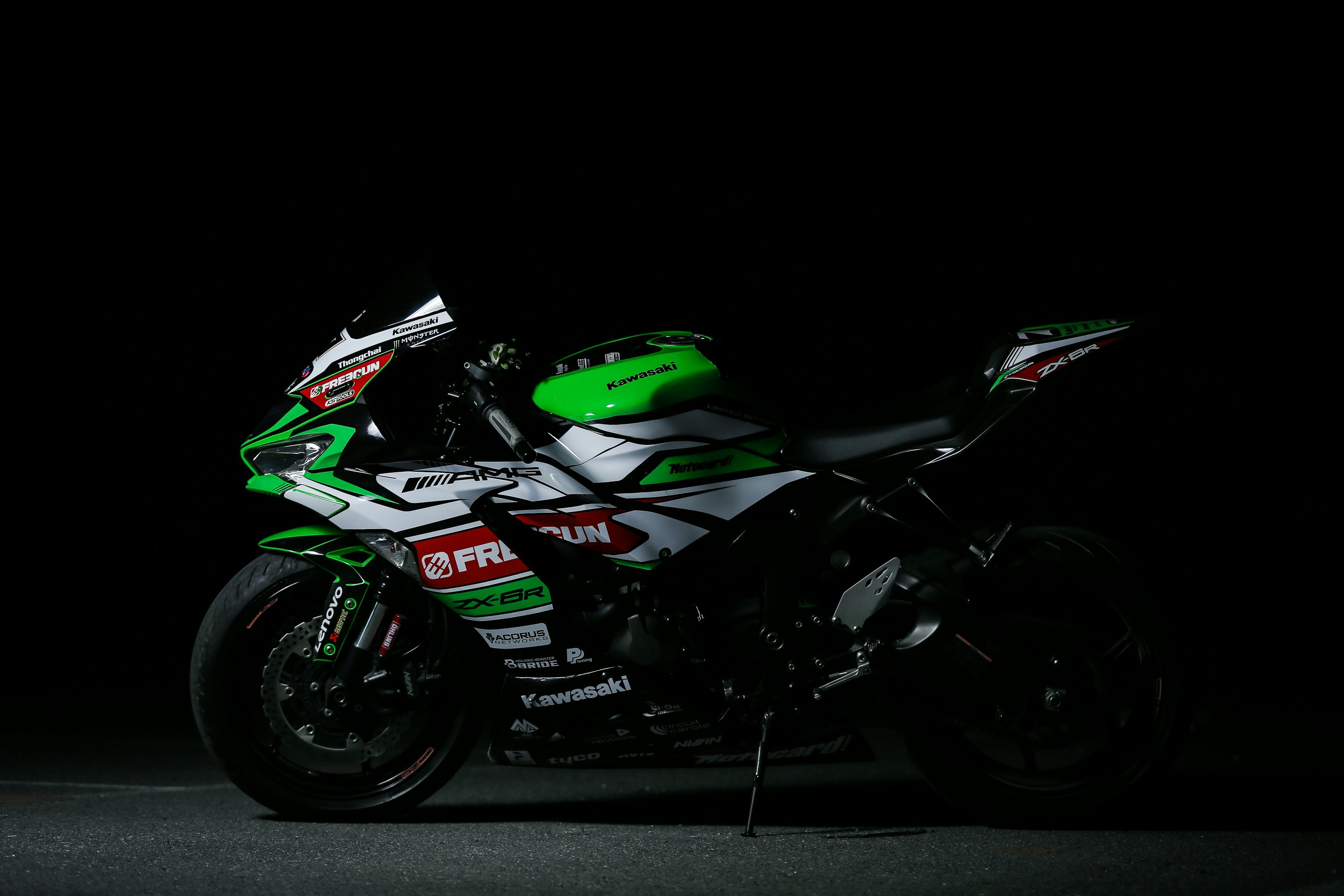 green and black honda sports bike