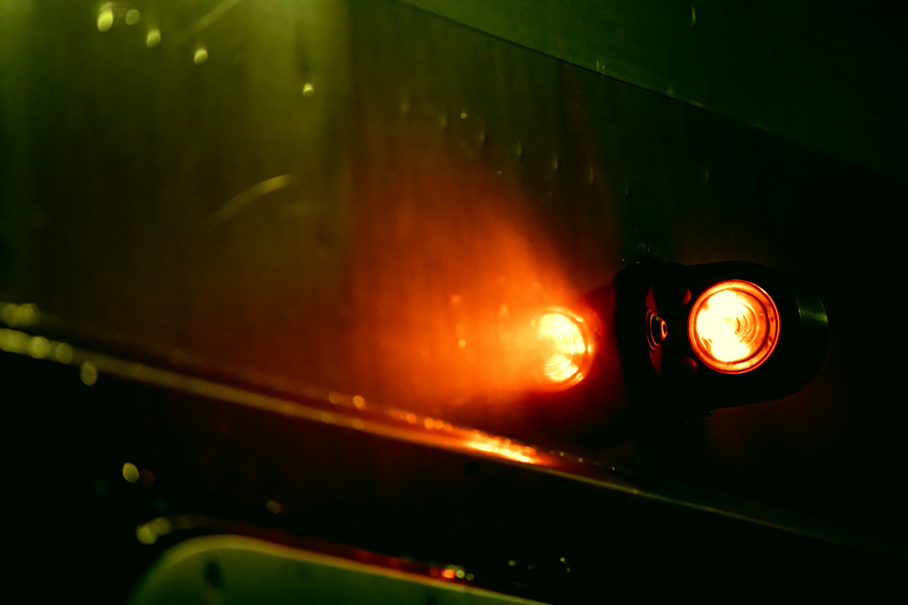 a red light on a black surface