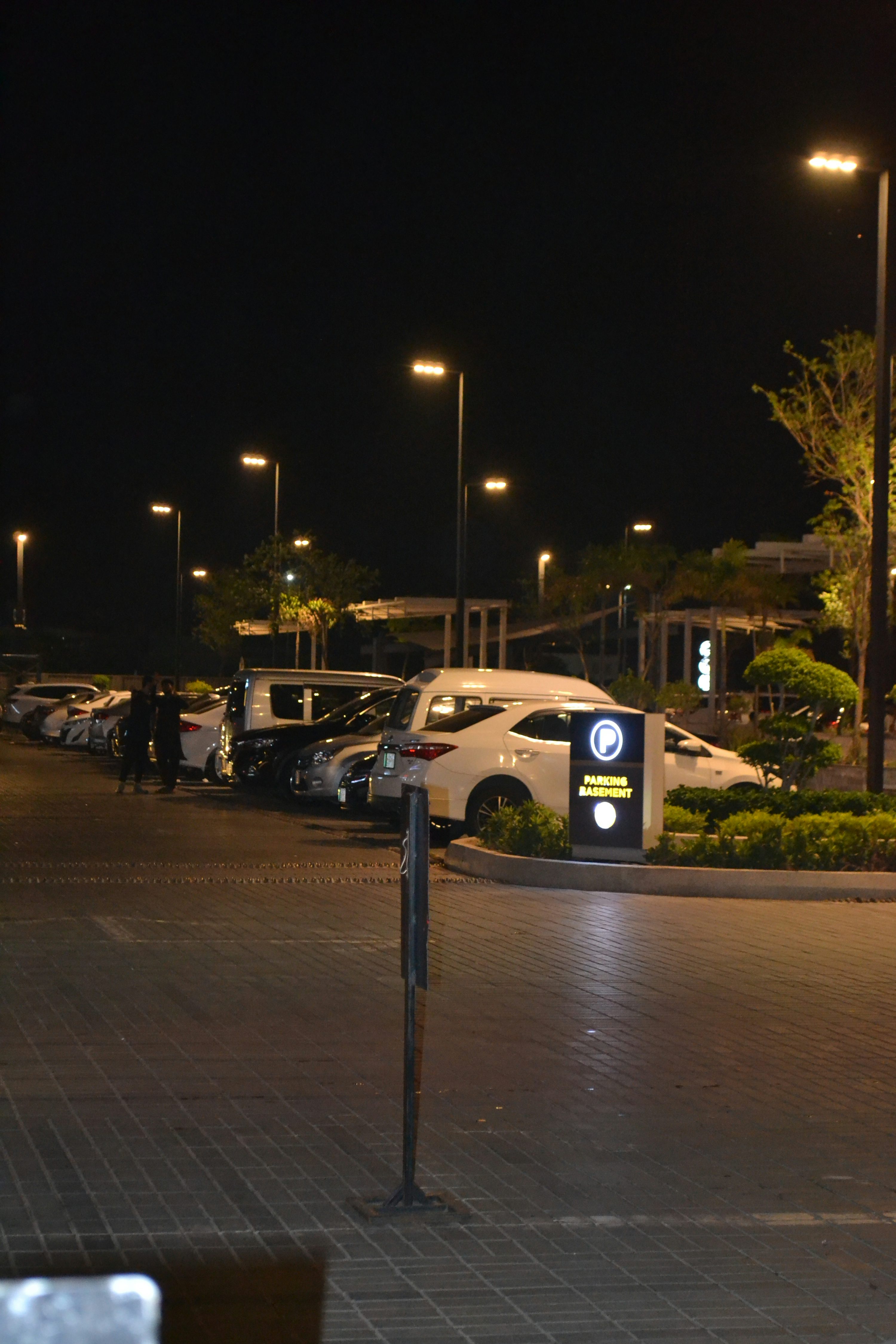 A parking lot filled with lots of parked cars