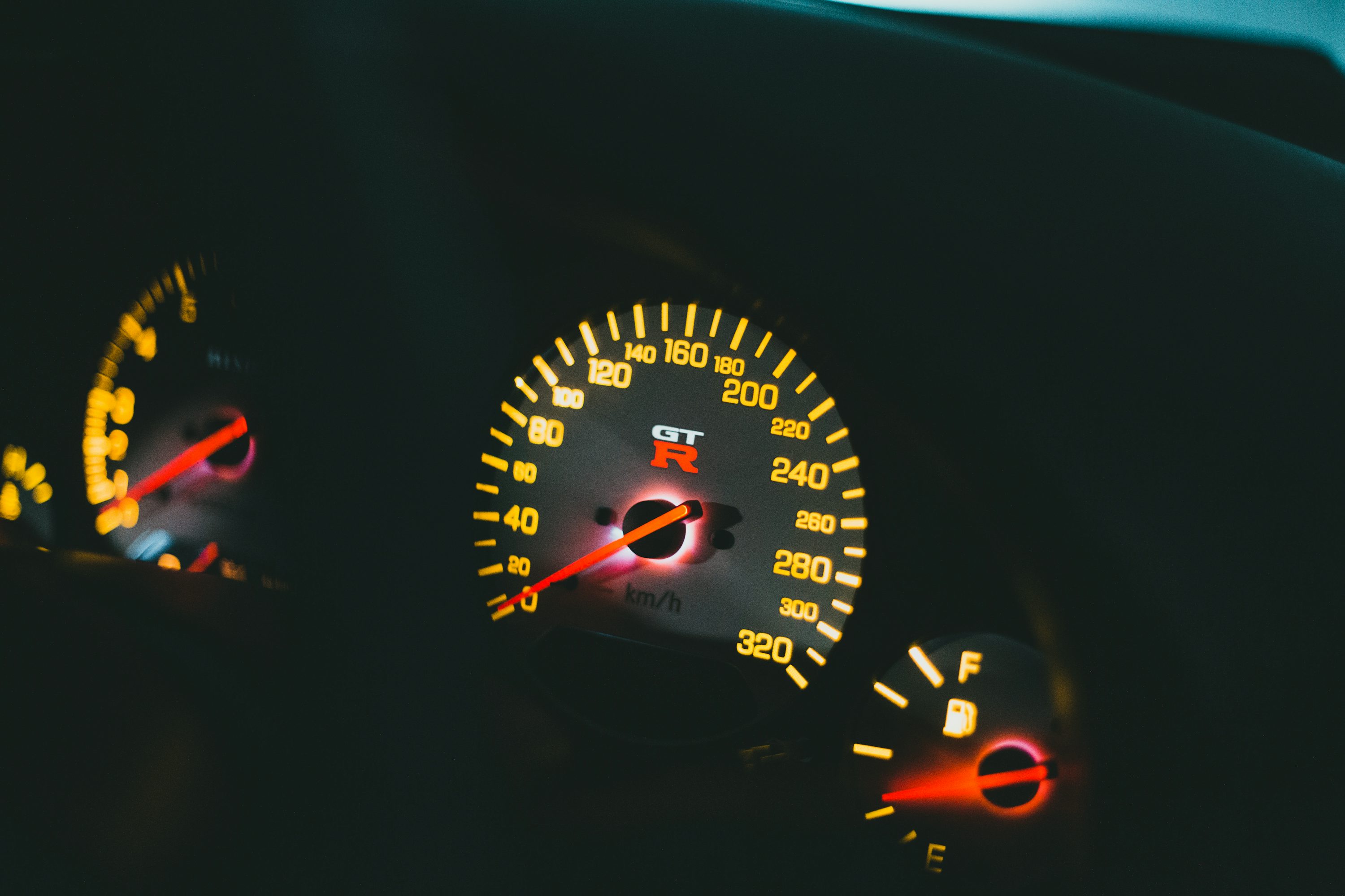 a close up of a speedometer in a car