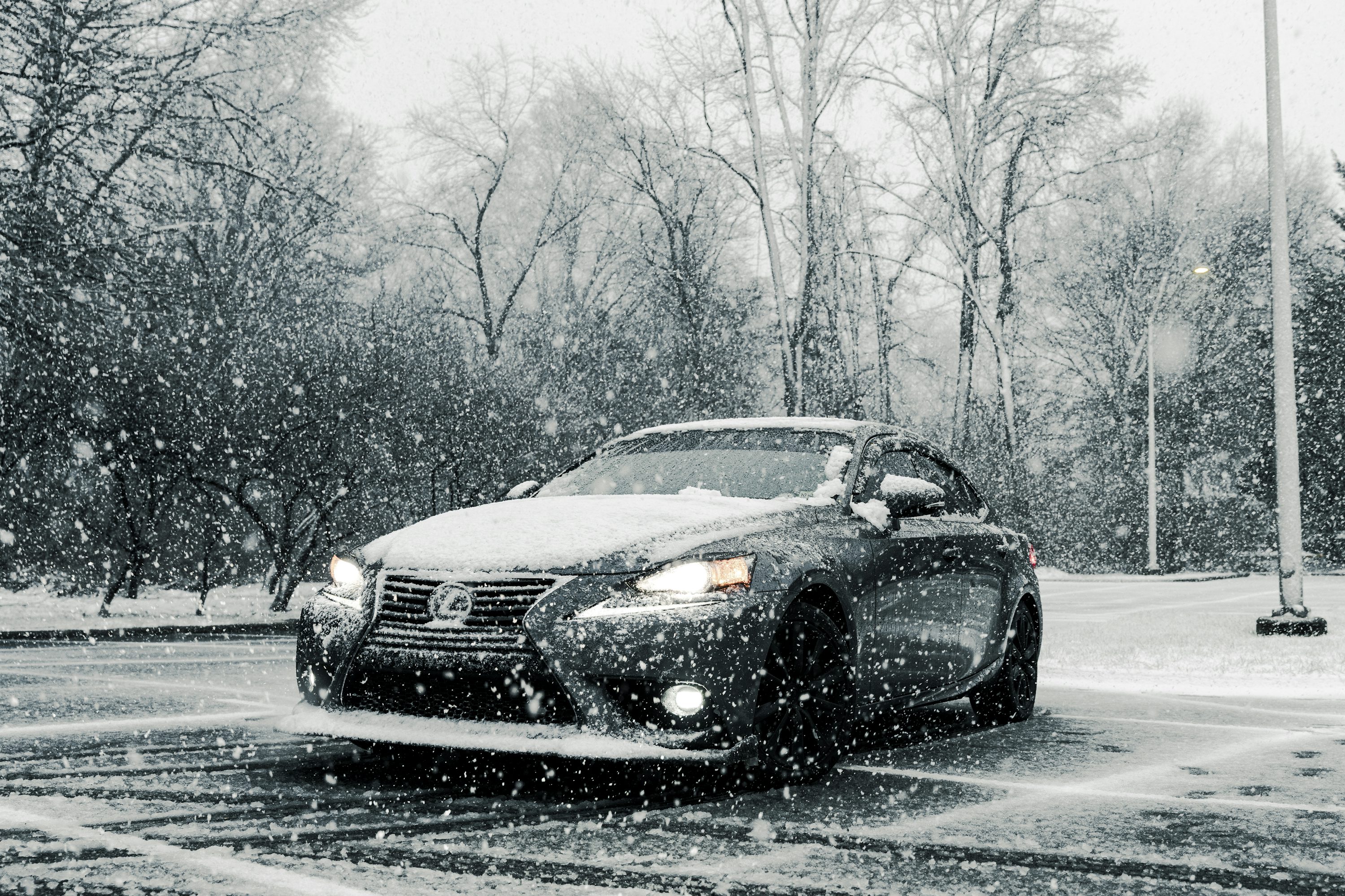 A car driving down a snow covered road