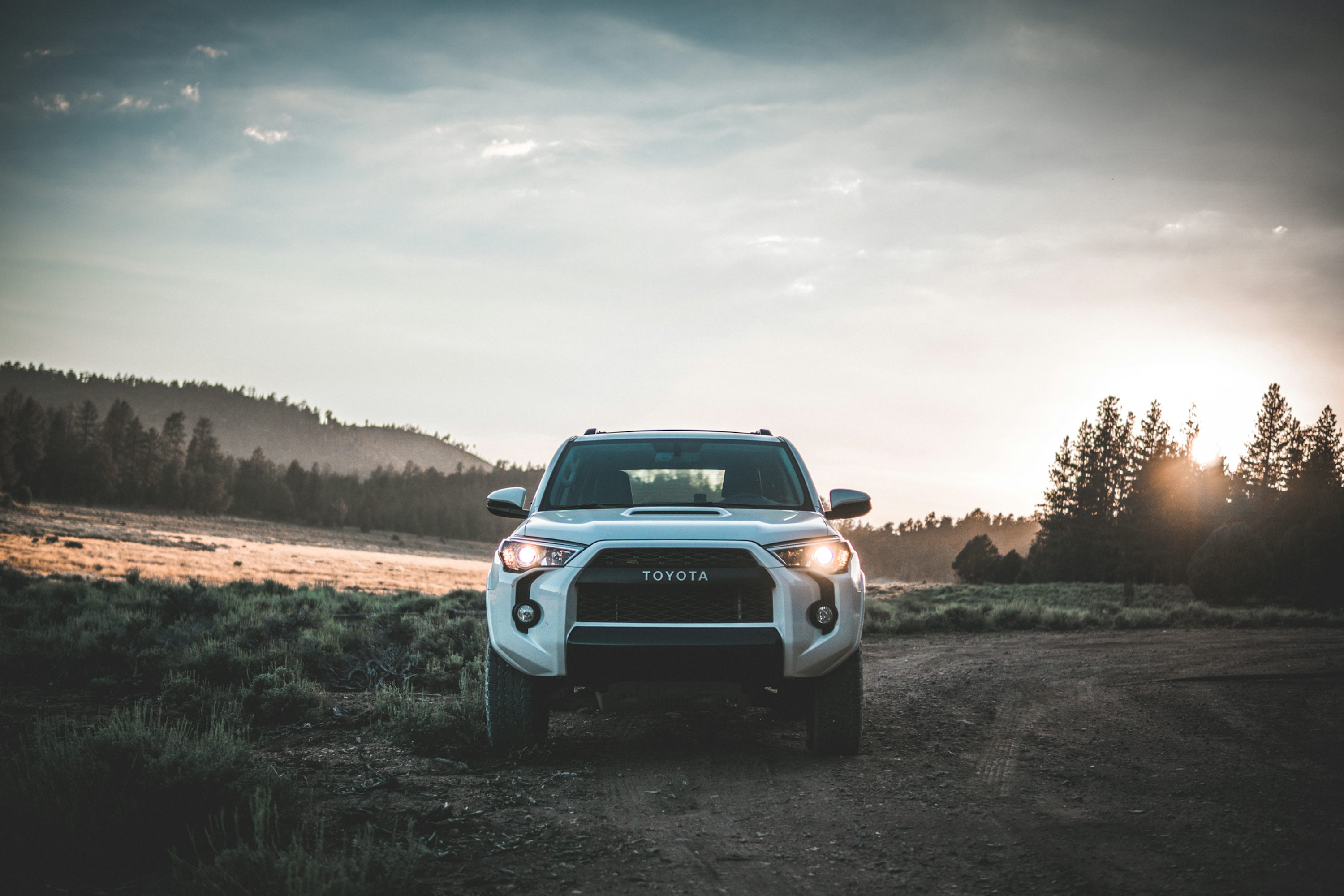 parked white Toyota vehicle