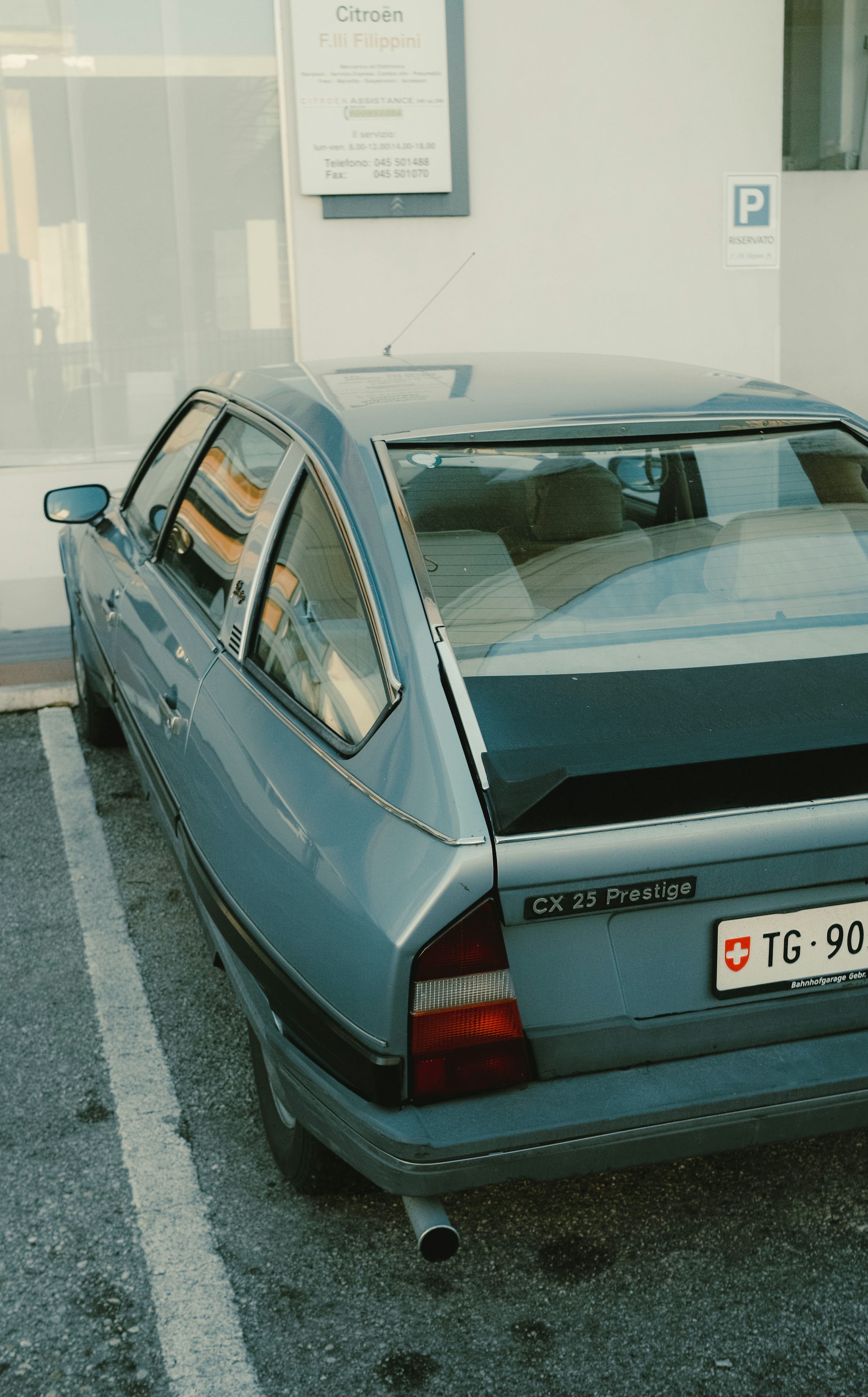 a blue car parked in a parking space