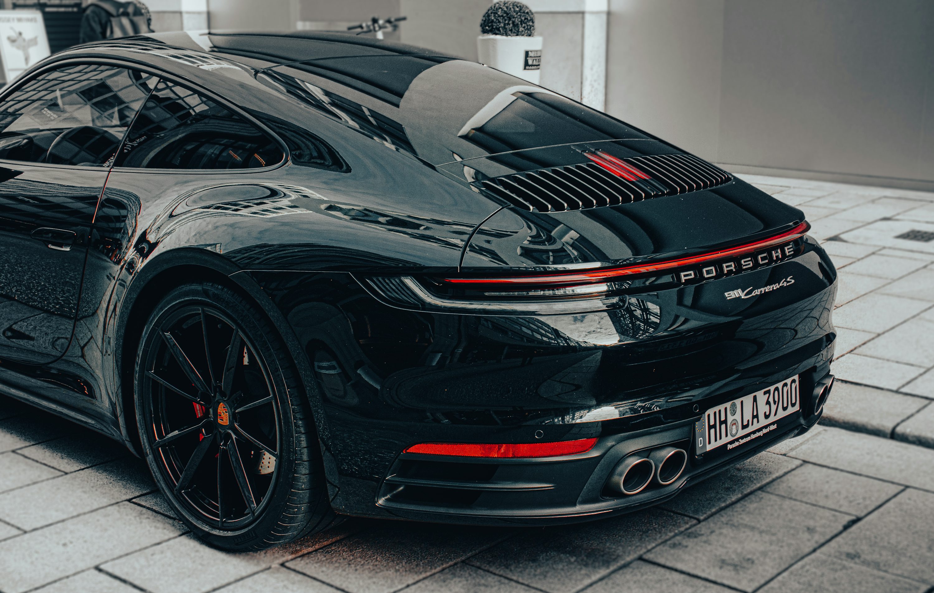 a black sports car parked on the side of the road