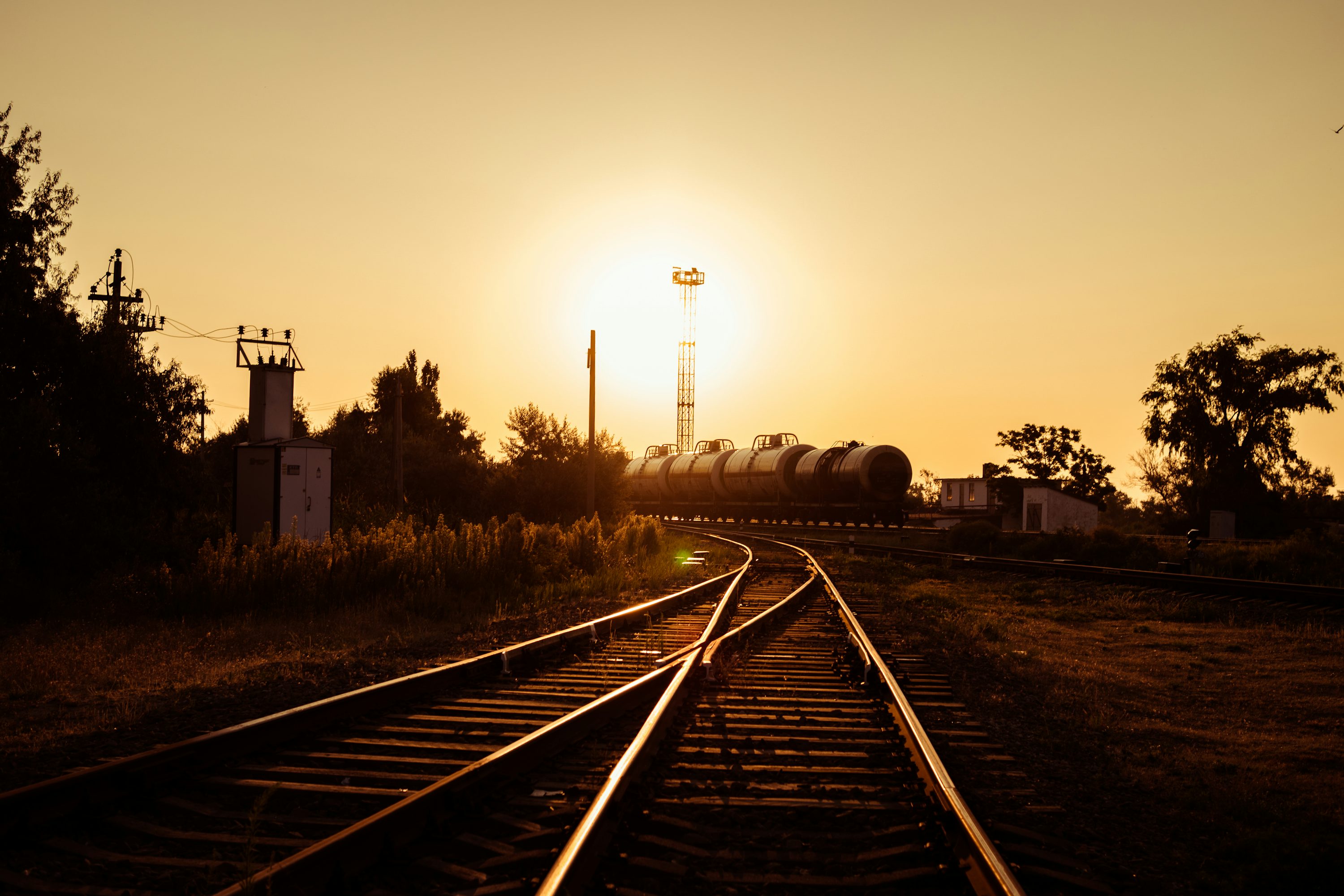 silhouette of electric post during golden hour