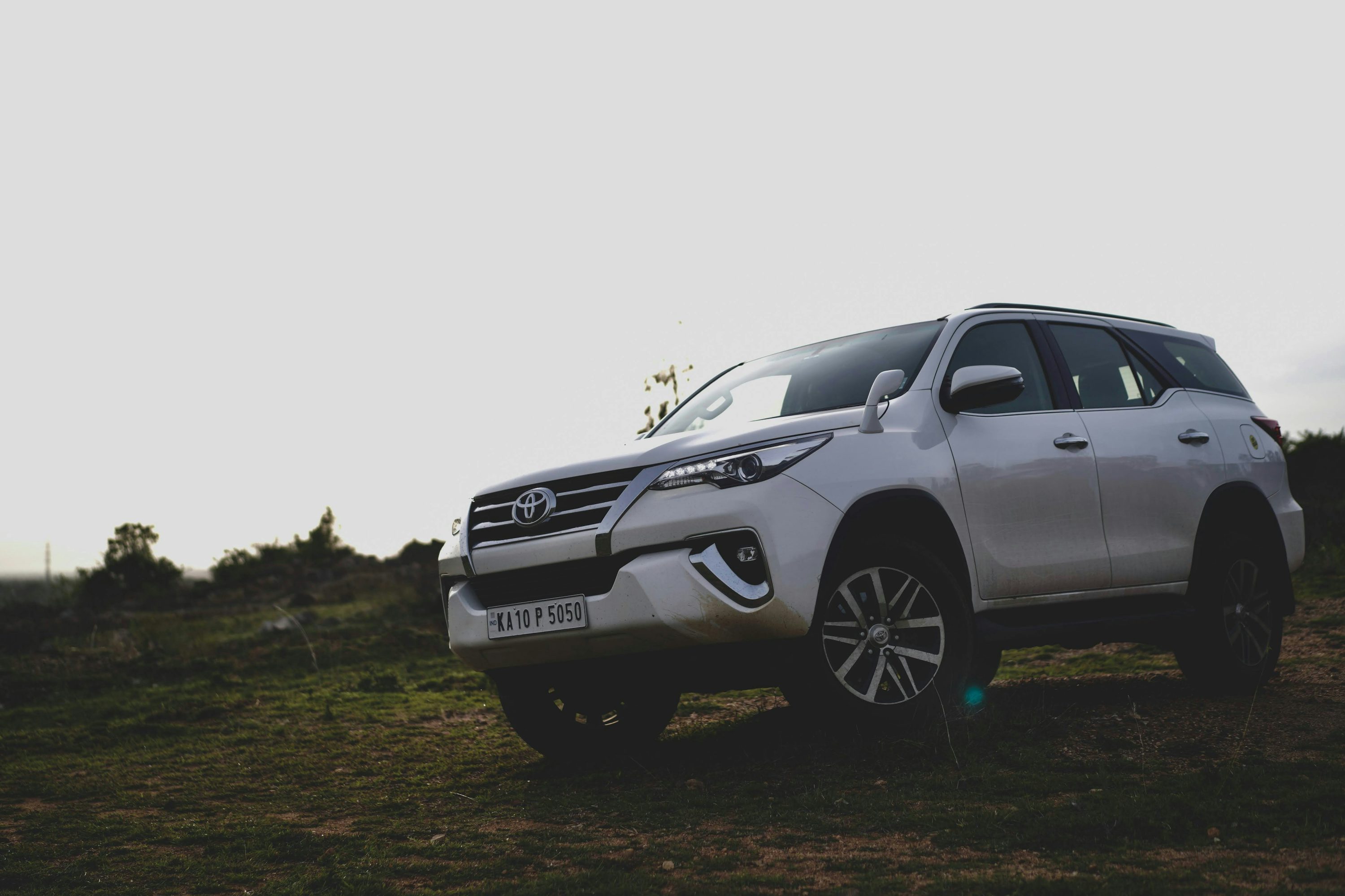 a car parked on a dirt road