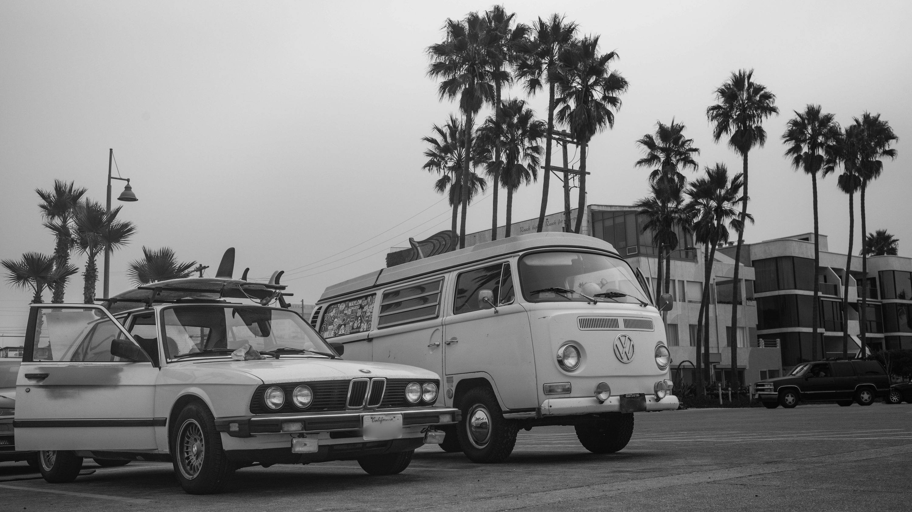 a bus and a car parked in a parking lot