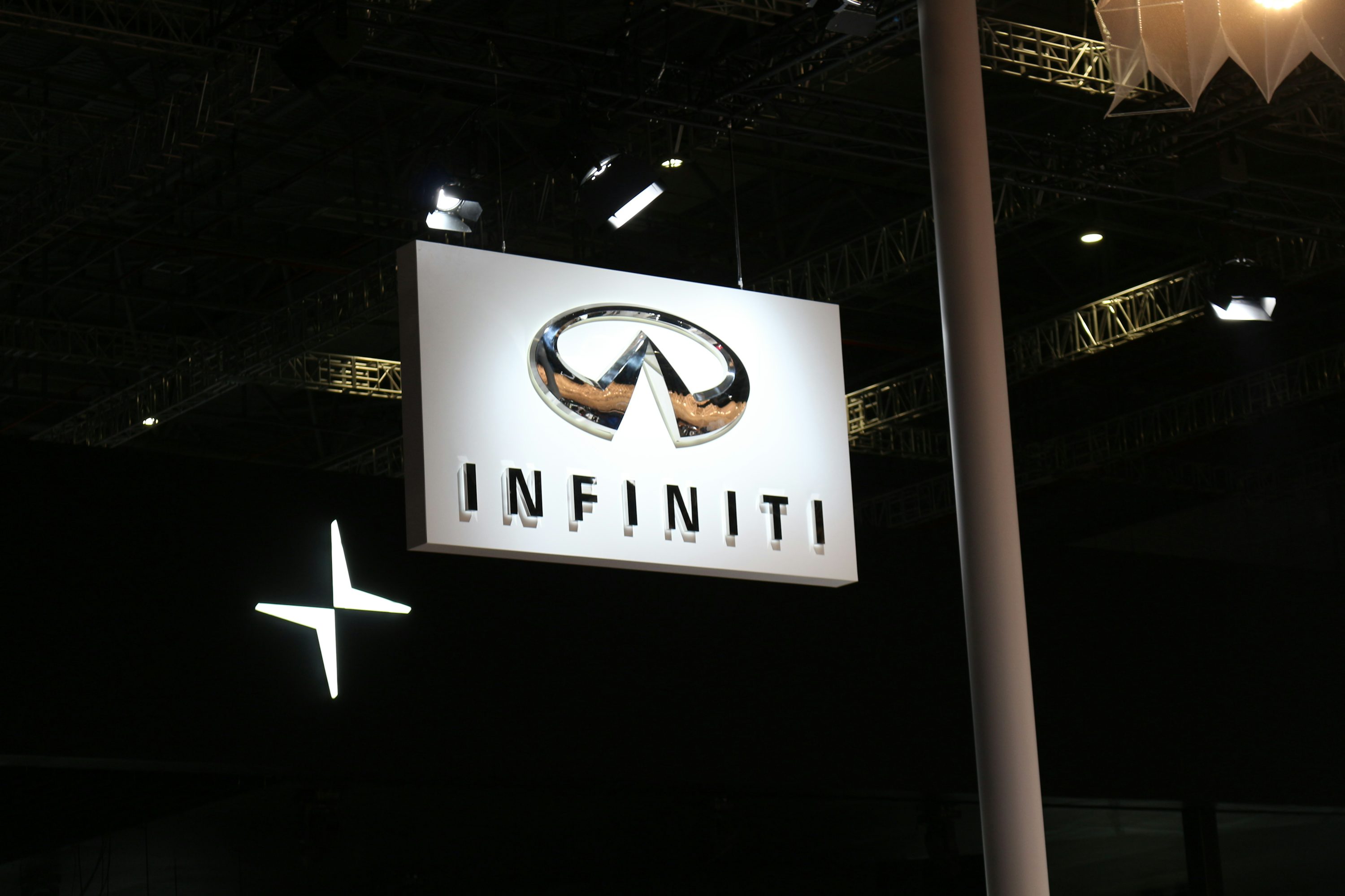 a sign hanging from the ceiling of a building