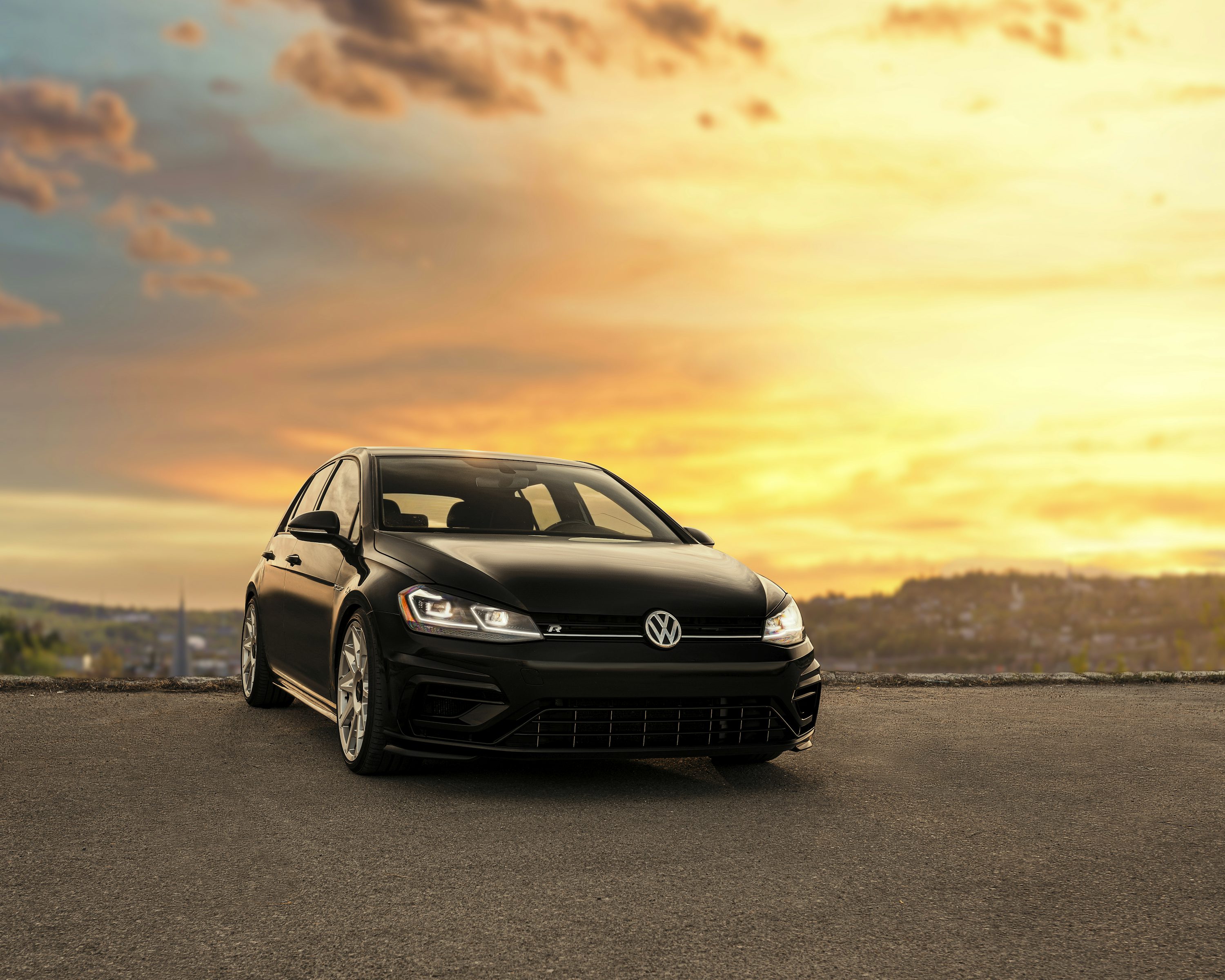 black mercedes benz c class on gray asphalt road during sunset