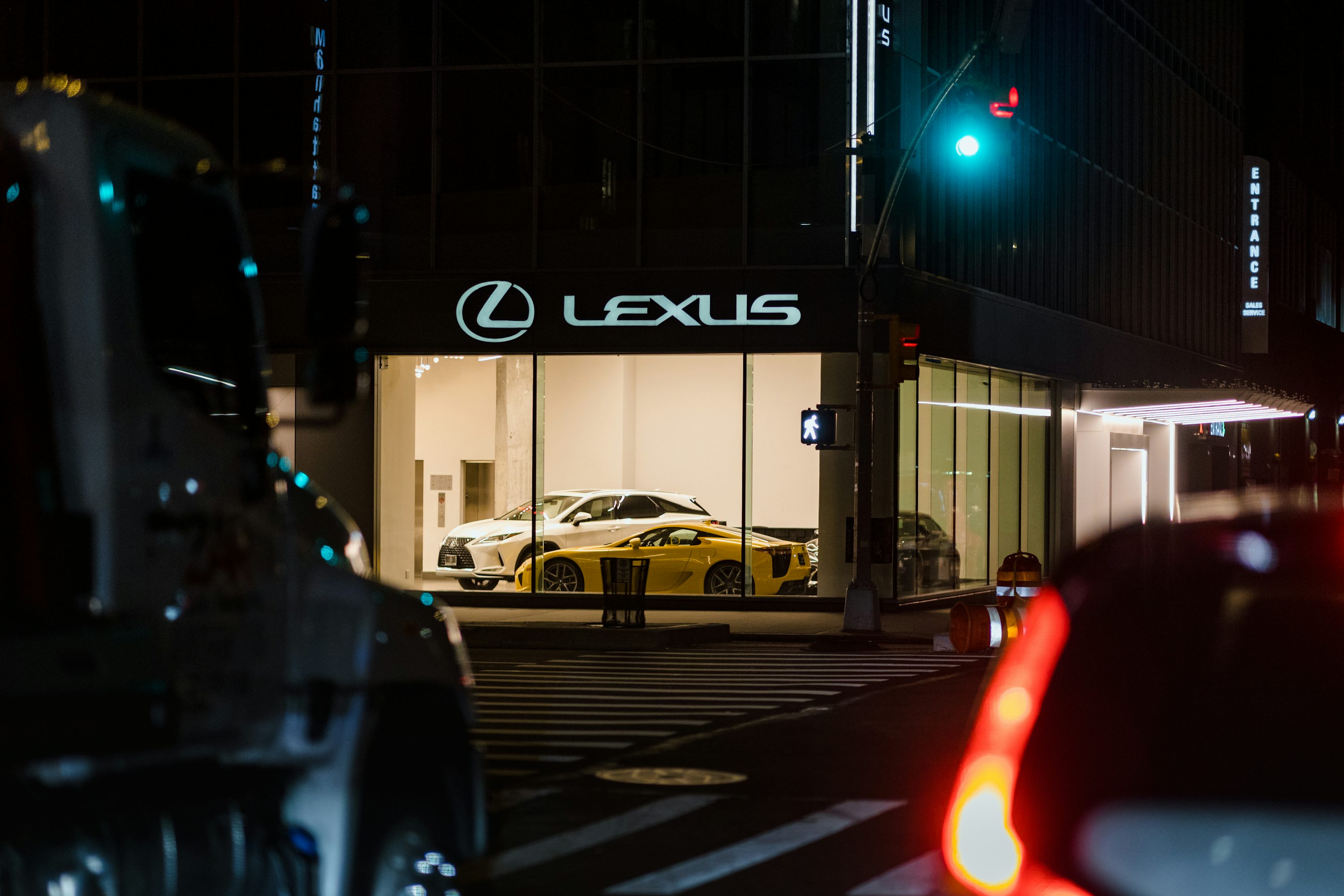 a yellow car in a parking lot