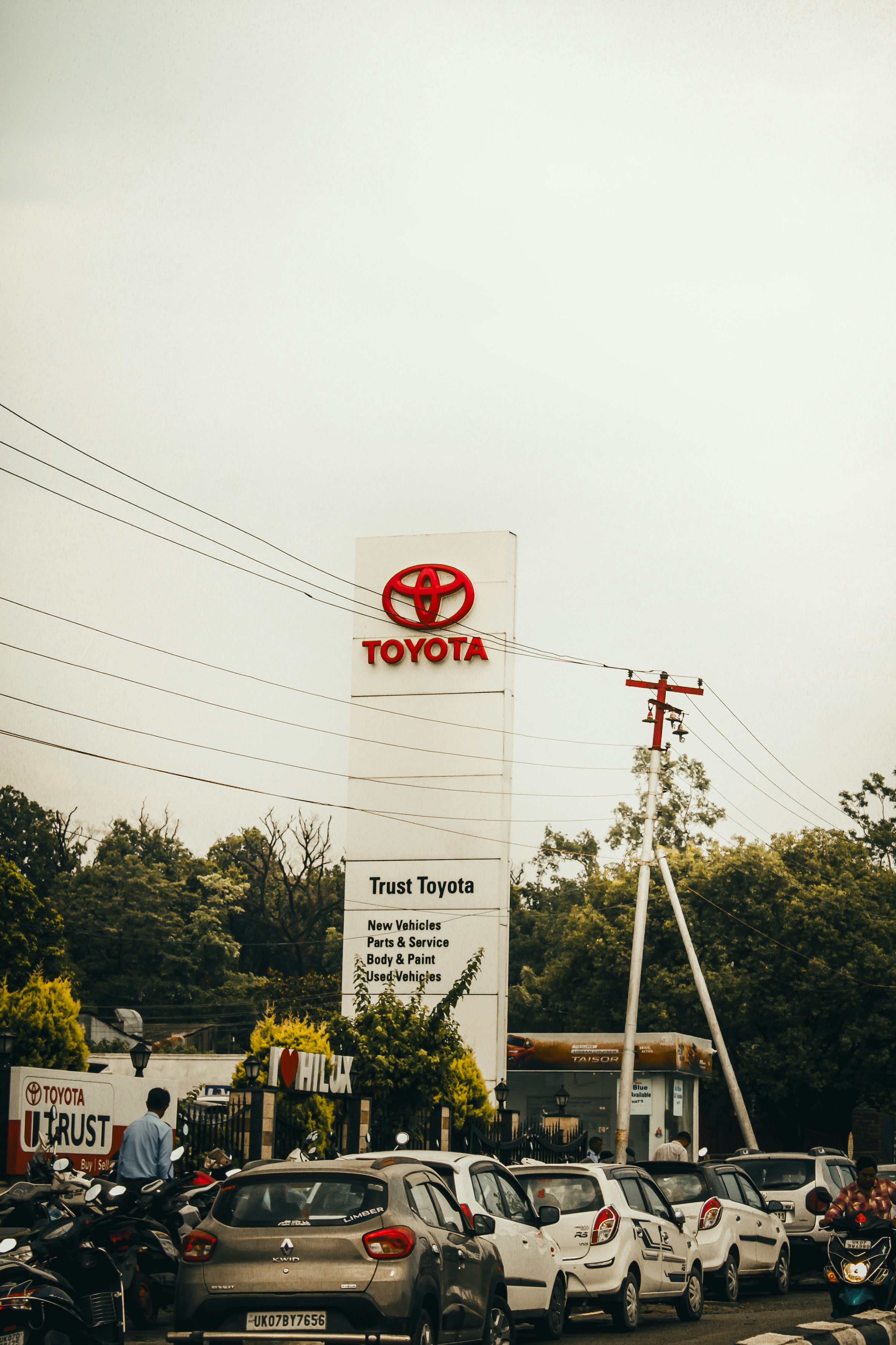 A toyota dealership is shown on a cloudy day.
