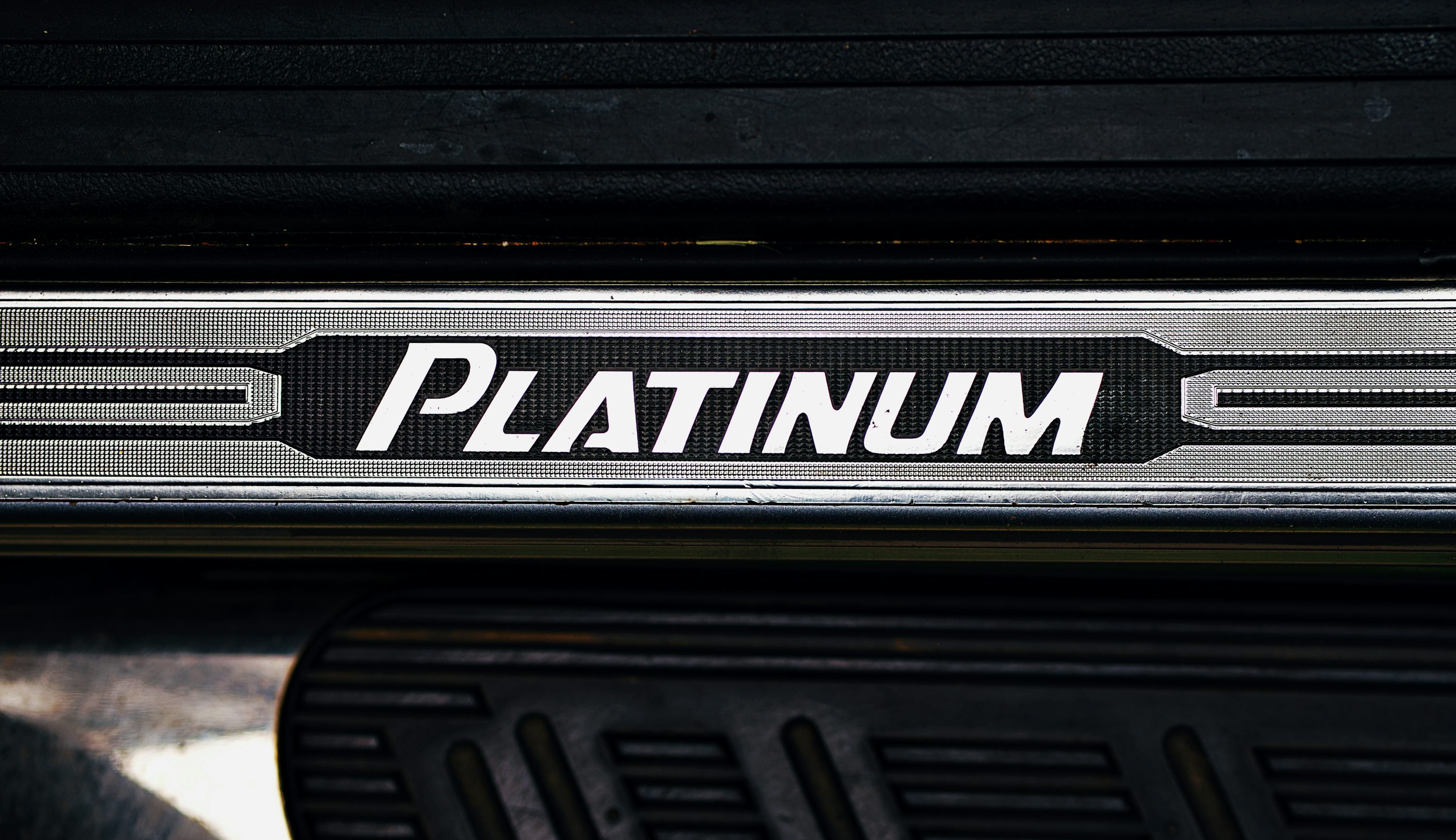 The image shows a car's "platinum" door sill.