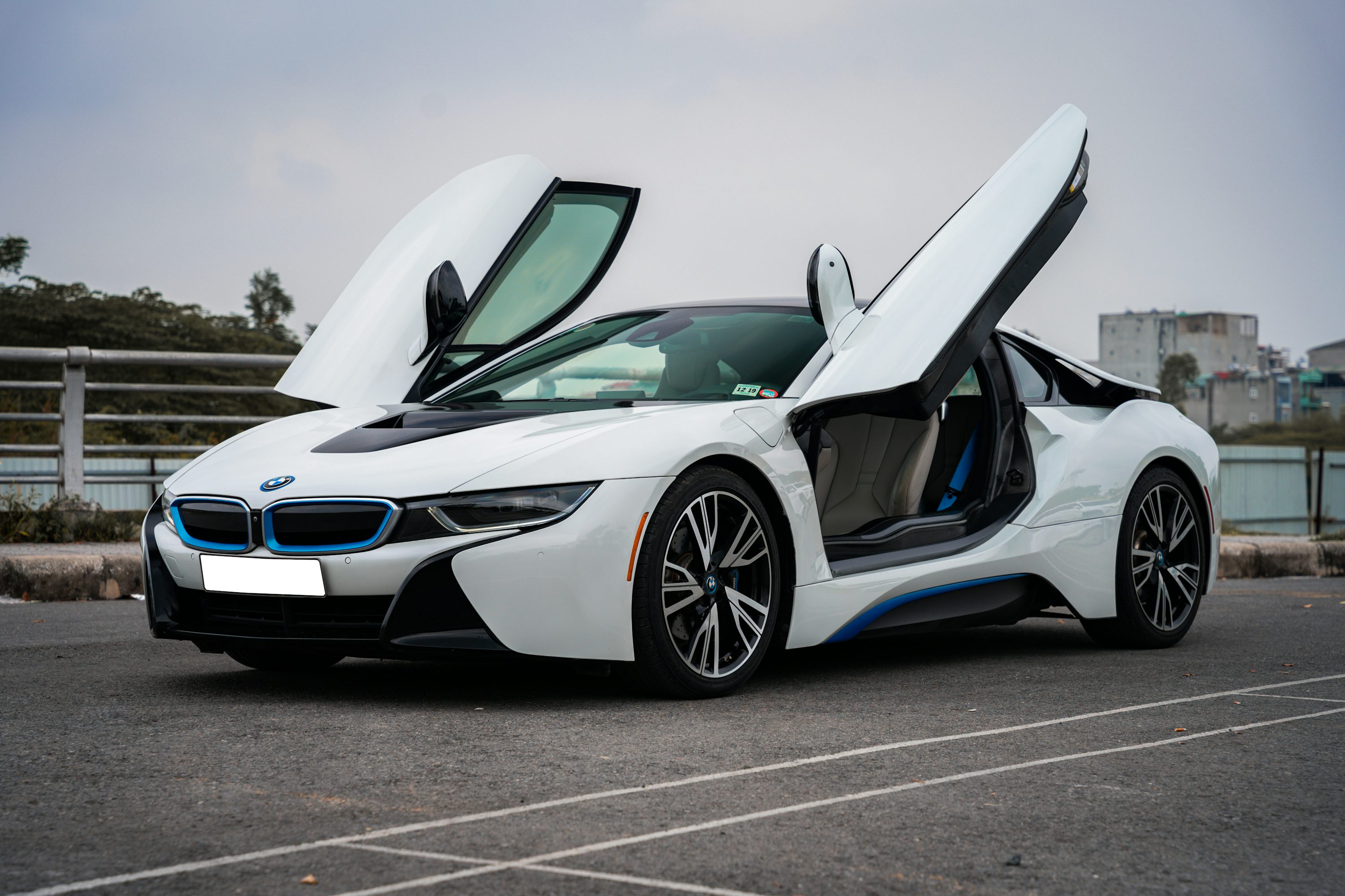 a white sports car with doors open