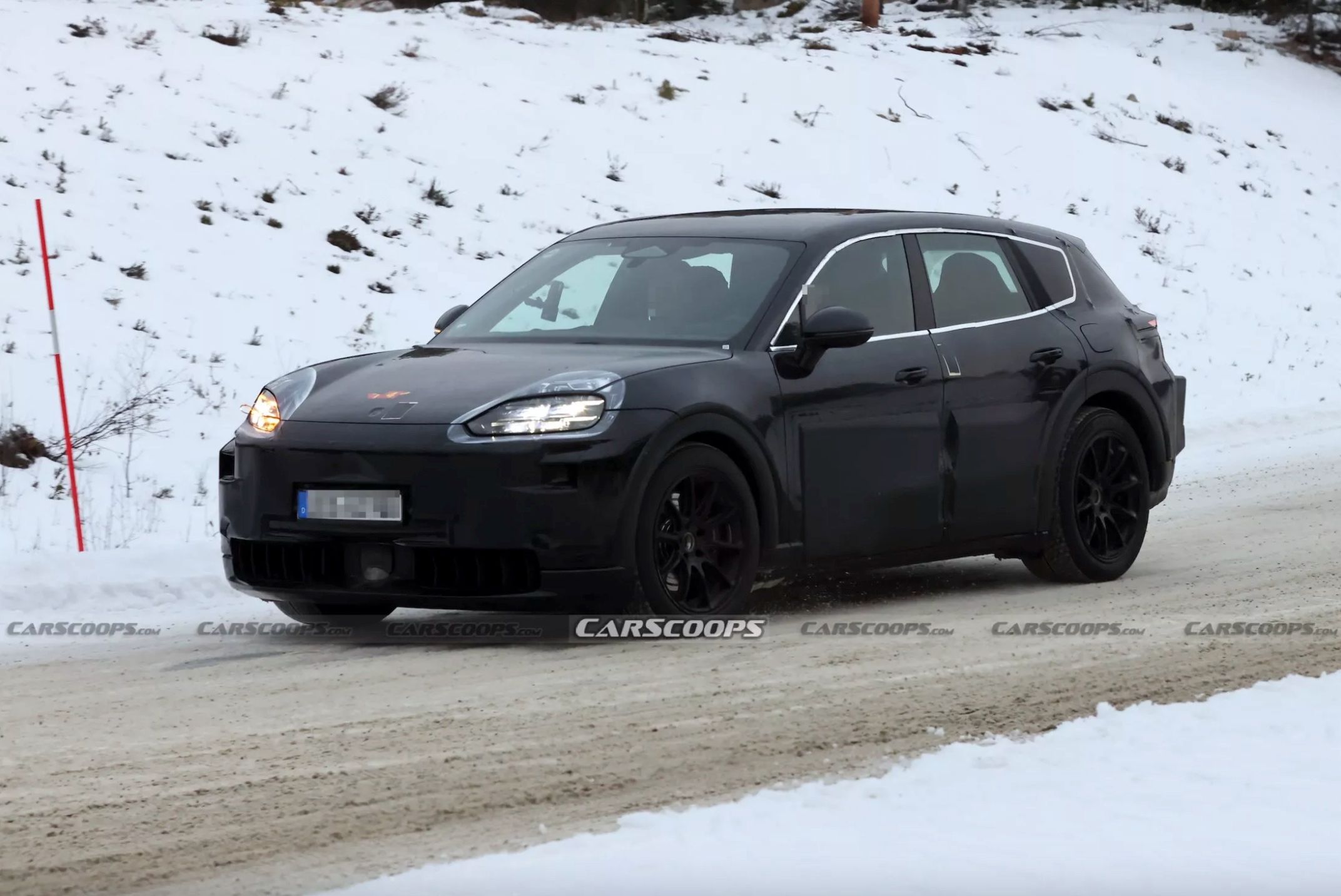 Porsche’s upcoming electric Cayenne has been spotted undergoing snow tests. However, the company revaluates its EV strategy