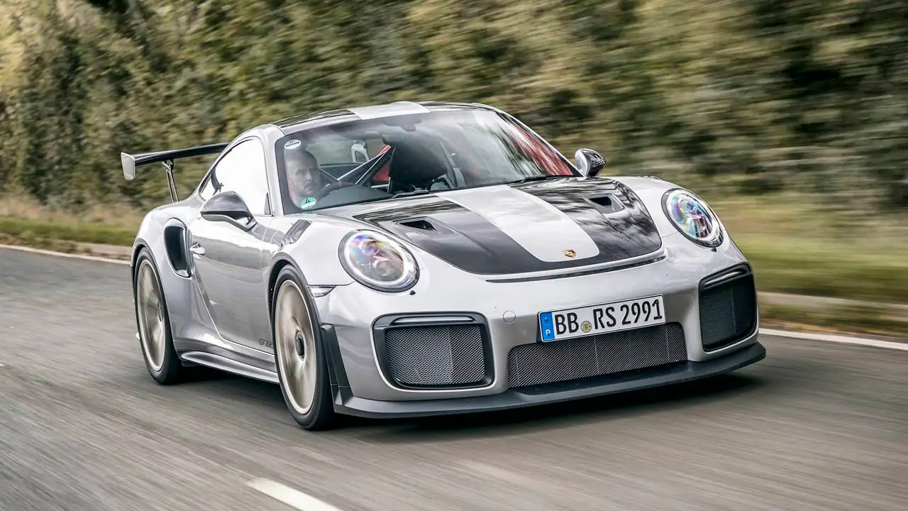 Porsche is developing a new 911 flagship, likely the next GT2 RS, featuring over 700 hp and advanced hybrid technology.