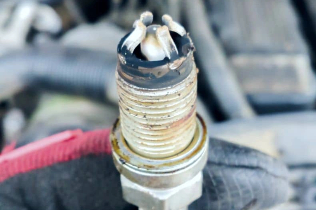 Know what white spark plugs mean, why they're dangerous, and how to prolong their lifetime. 