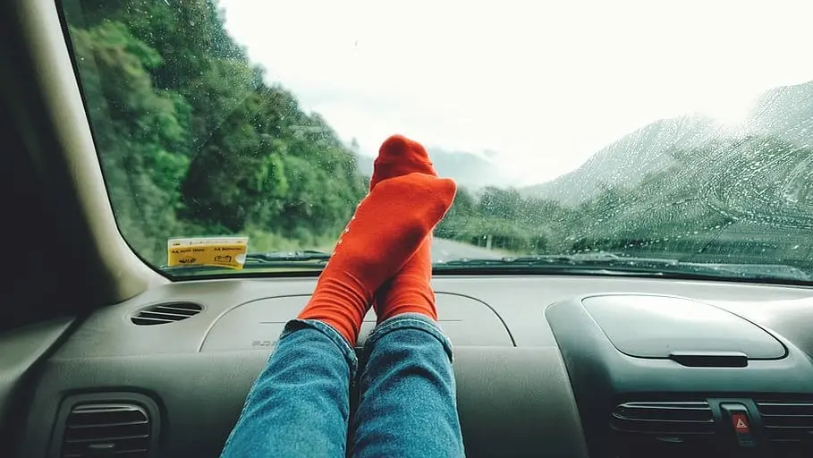 Putting your feet on the dashboard can lead to serious injuries in accidents. Discover the hidden dangers and how to stay safe.