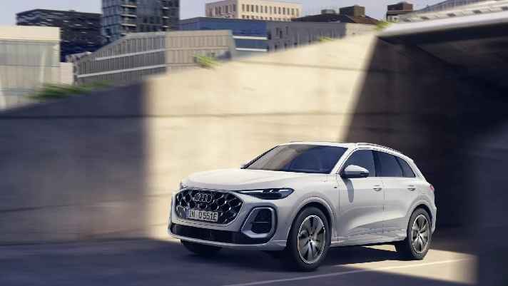 The new Audi Q5 hybrid offers up to 100 km electric range, faster charging, sporty performance, advanced technologies, and a luxurious design.