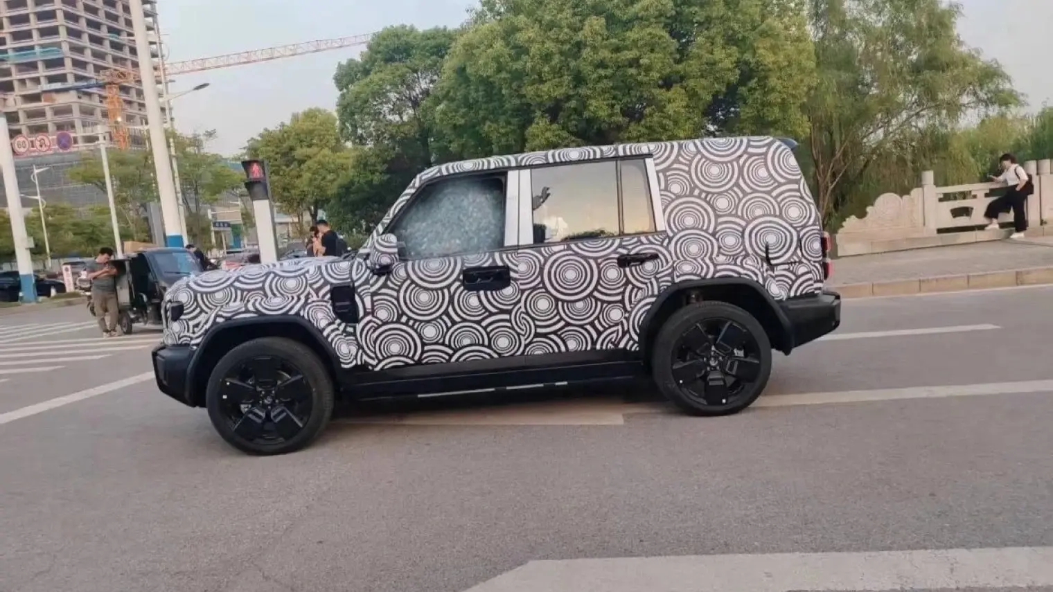 Chery is testing a new hybrid model, possibly named iCAR 05, with a boxy modern design, advanced EREV powertrain, and potential shift to the main Chery brand.