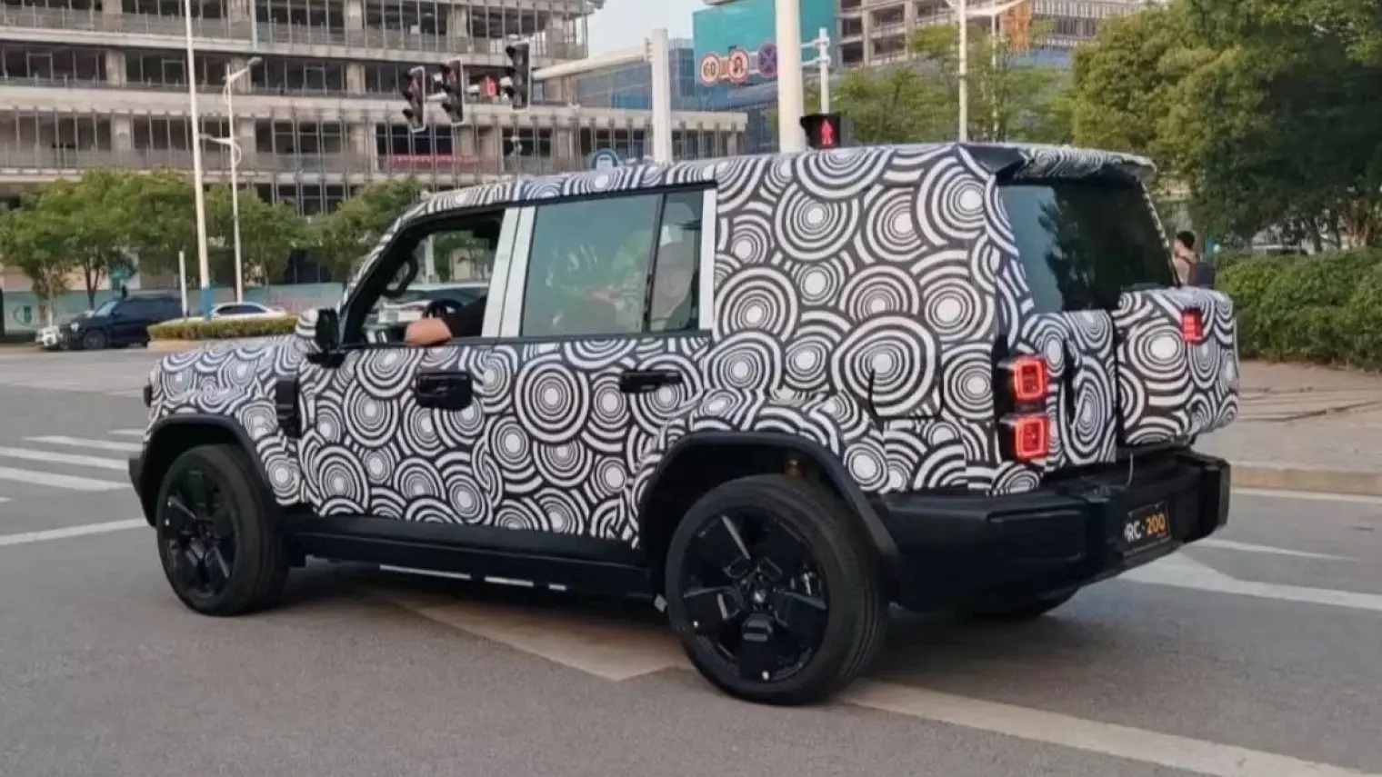 Chery is testing a new hybrid model, possibly named iCAR 05, with a boxy modern design, advanced EREV powertrain, and potential shift to the main Chery brand.