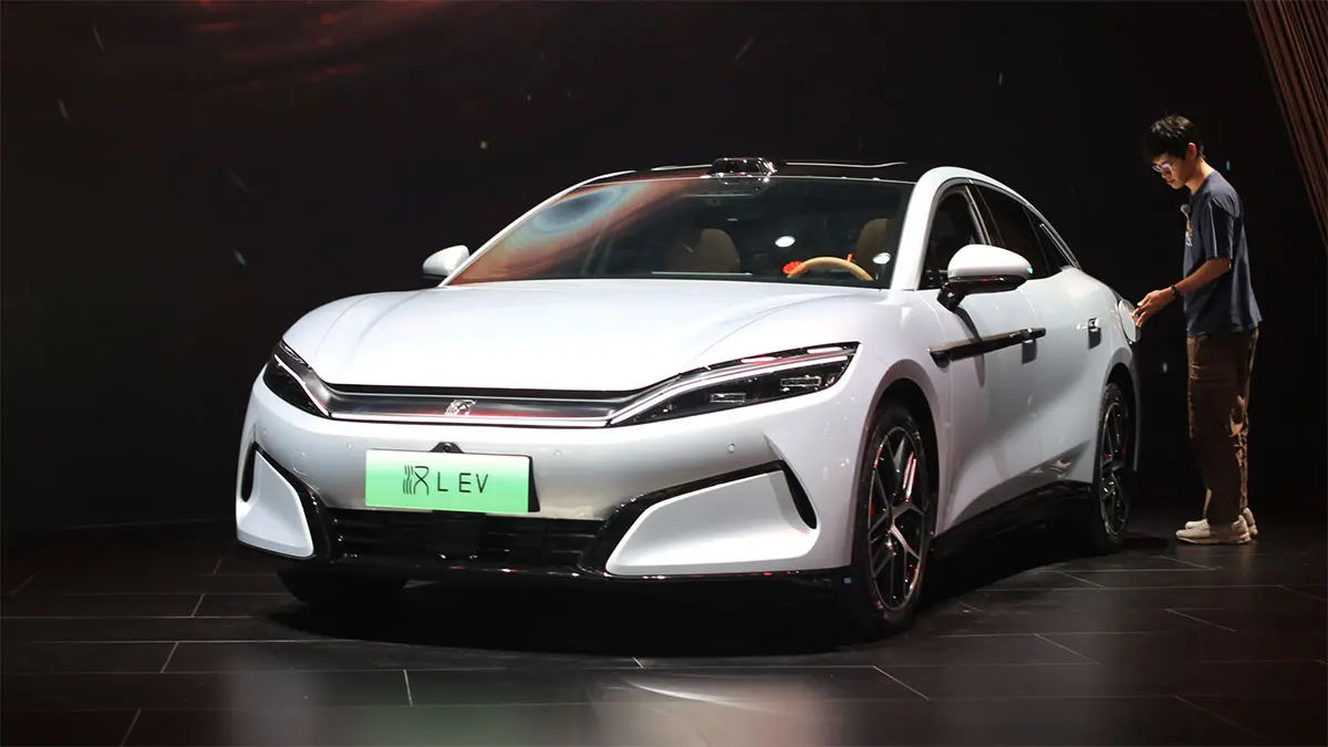 BYD warns of unsustainable EV price wars in China and shifts focus to Europe, planning major investments to strengthen its global presence and long term growth.