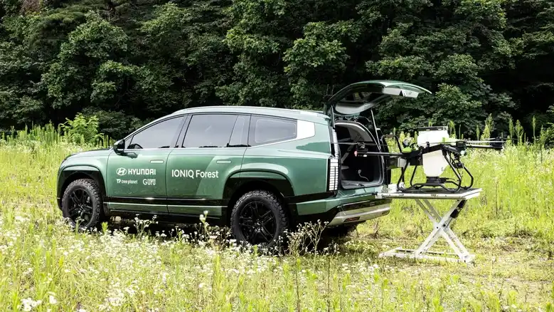 Hyundai introduces an eco-friendly initiative by transforming an electric vehicle into a mobile platform using drones to plant seed balls in damaged forests. 
