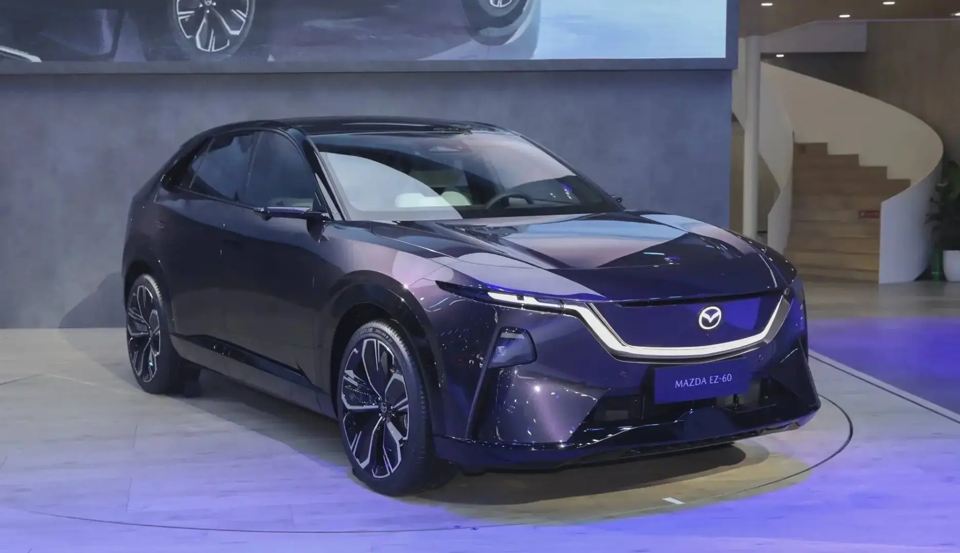 The Mazda EZ-60 enters production in China with over 38,000 reservations, a sleek aerodynamic design, smart cockpit tech, and global road testing completed.