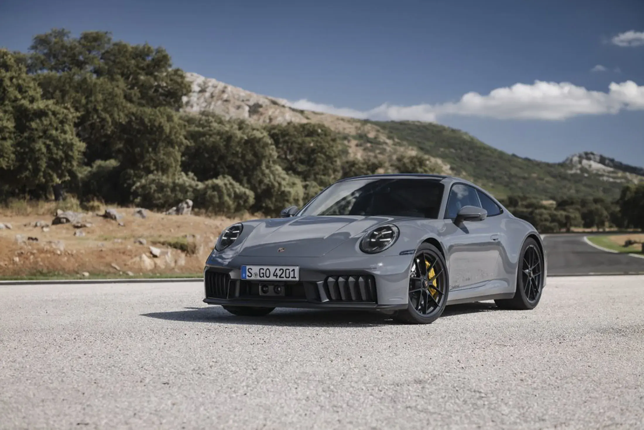 The 2025 Porsche 911 arrives with its first ever hybrid system, updated design, enhanced performance, and prices starting from 588,500 SAR in Saudi Arabia.