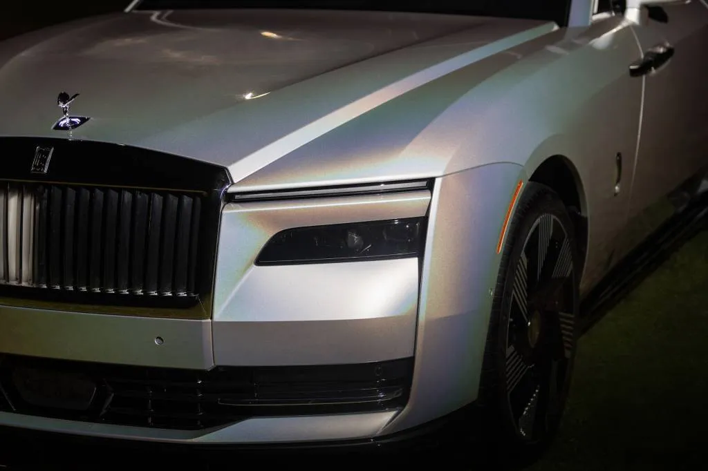 Rolls-Royce has unveiled a uniquely customized electric car, the Spectre Lunaflair, featuring a color-shifting paint inspired by the lunar halo.